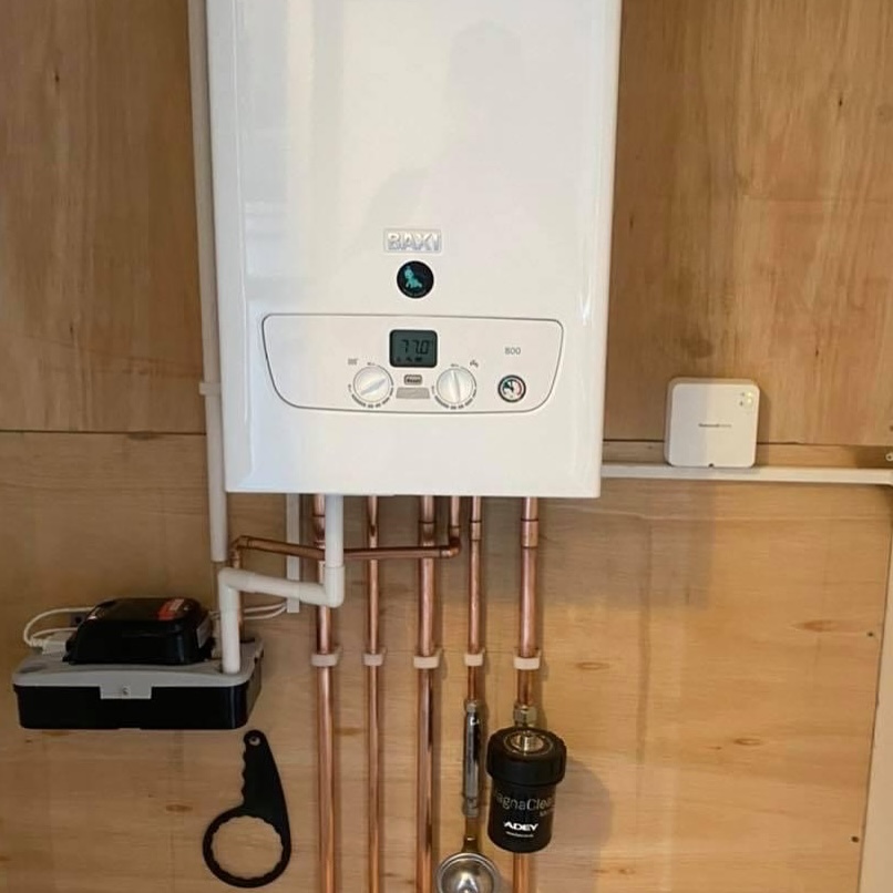 A boiler on a wooden wall